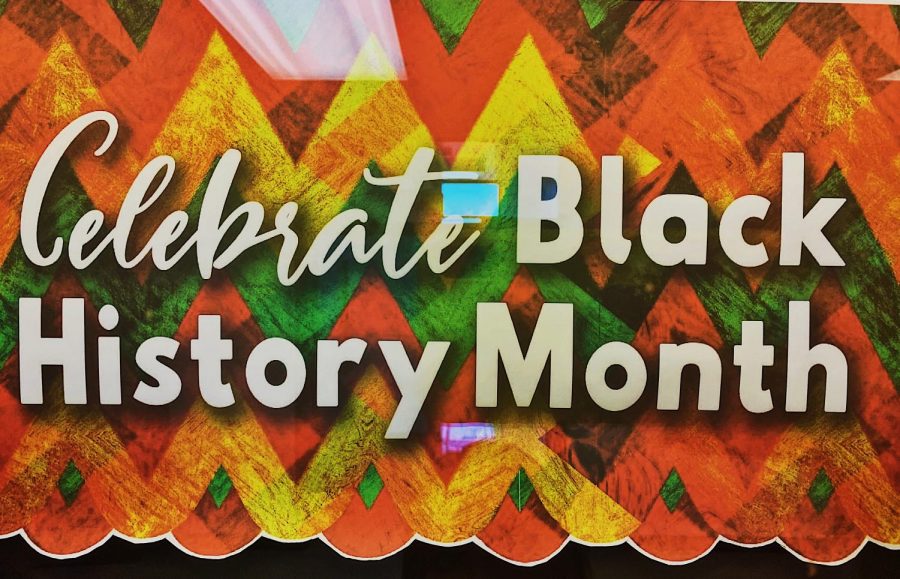 Outside of the library, Black History Month posters are displayed to celebrate diversity within Central. 