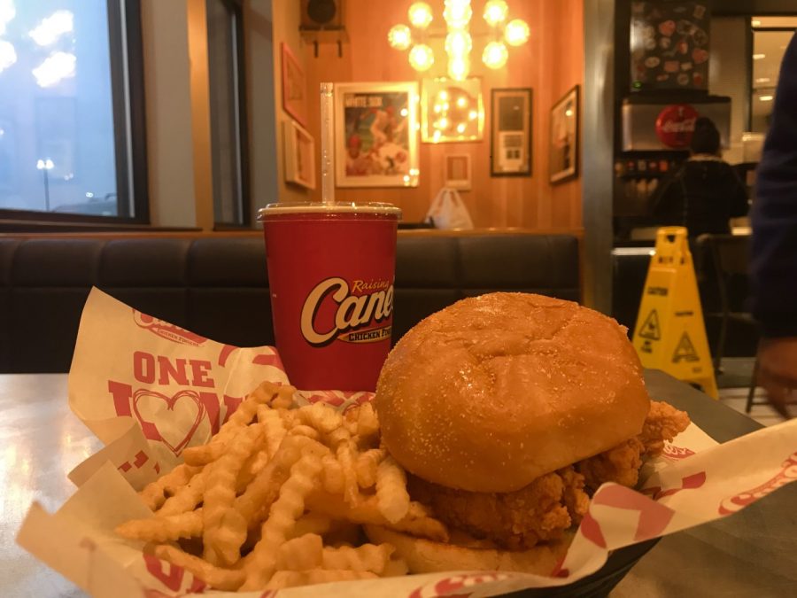 The Raising Canes special burger, consists of chicken fingers, customized toppings, and Canes sauce. 