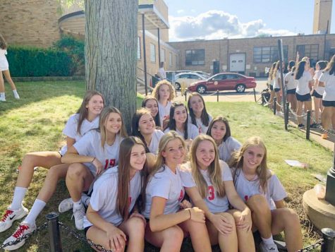 In contrast to the girls sophomore volleyball team (above) in 2019, the team now mandates that players stay socially distant. 