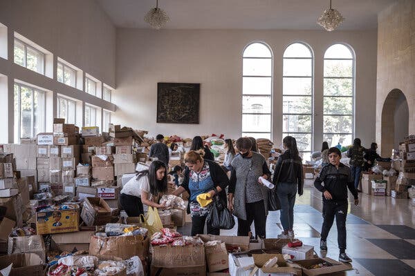 Refugees fleeing the Nagorno-Karabakh region visit a food distribution center in Goris, Armenia, on Friday, Oct. 7.