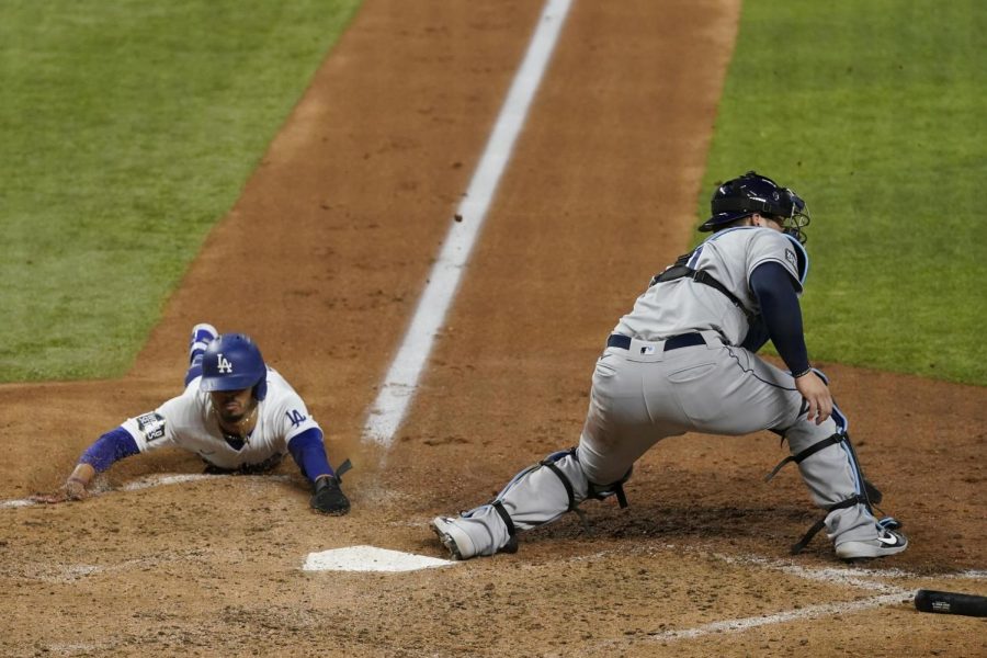 Mookie Betts slides into a victory for the Dodgers.