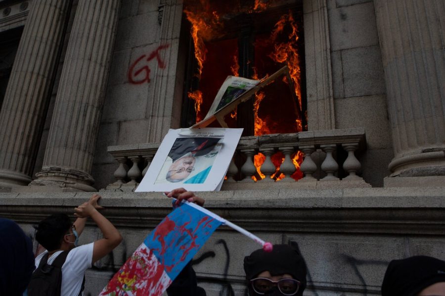 Protesters set Guatemala’s Congress on fire in Guatemala City on Saturday, Nov. 21. (Courtsey of Oliver De Ros/Associated Press & The New York Times)