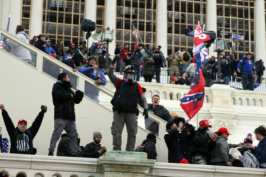 Pro-Trump protesters stormed the Capitol and waved Confederate and Trump 2020 flags as they contested Bidens presidential victory.