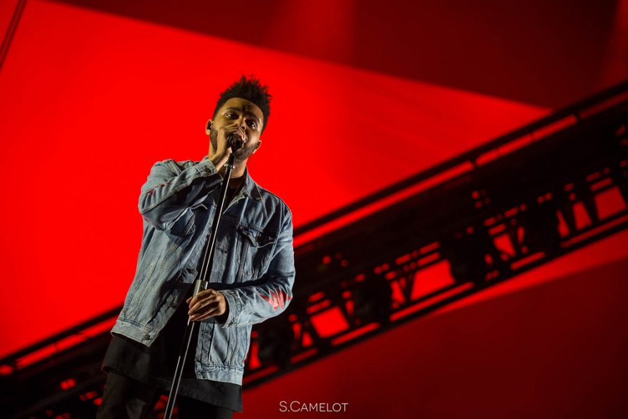 The Weeknd performs hit songs during the annual Superbowl Half Time show. (pictured above is The Weeknd performing at Lollapalooza in 2017). 
