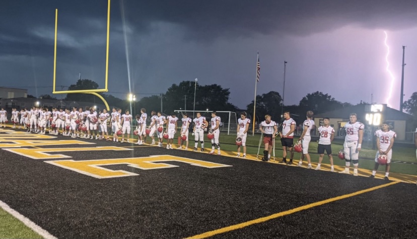 The+HCHS+varsity+football+team+plays+at+Hinsdale+South+on+Friday%2C+Sept.+17%2C+beating+the+team+by+49-0.+The+weather+caused+the+game+to+start+an+hour-and-a-half+late.
