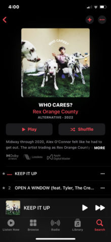 WHO CARES? by artist Rex Orange County can be streamed on Apple Music,  Spotify, Pandora, and Youtube Music.