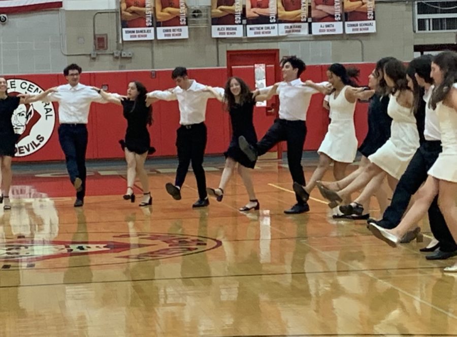 Students performing traditional Greek dance for their peers.