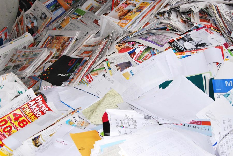 The school needs to look into purchasing recycled paper to reduce its paper waste. 
