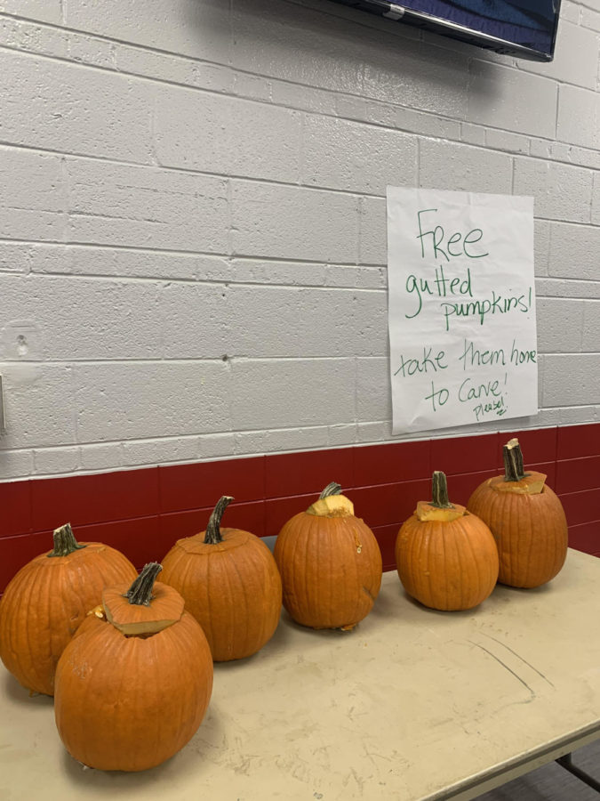 At+the+front+of+the+cafeteria+the+school+is+giving+away+free+gutted+pumpkins.+They+are+encouraging+students+to+take+them+home+and+carve+them.+This+is+yet+another+way+the+Halloween+spirit+is+being+spread+around+Hinsdale+Central.