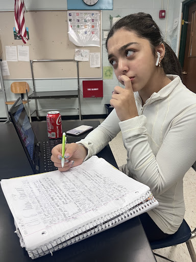 Finals Fest, held on Jan. 10 was designed to help students prepare for their exams. Junior Dareen Barakut contemplates her homework as she prepares to study for finals. 