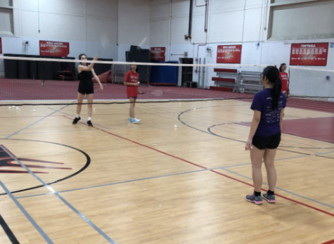 Junior Ella Graeb, senior Ivy Shen and junior Nora Sripraram warm up during practice. 