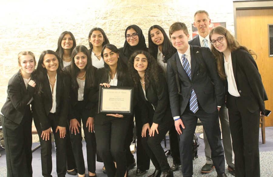 Members of the Mock Trial team after winning the Donna E. Schechter Memorial Law Test Award. (Photo courtesy of the Illinois State Bar Association)