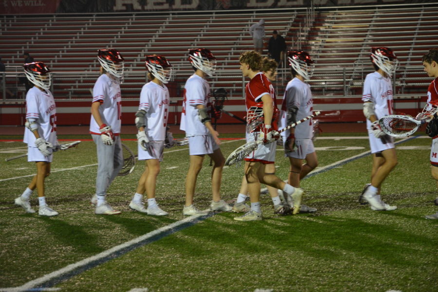 Boys varisty lacrosse shakes hand with Marist after this tough game. (SmugMug)