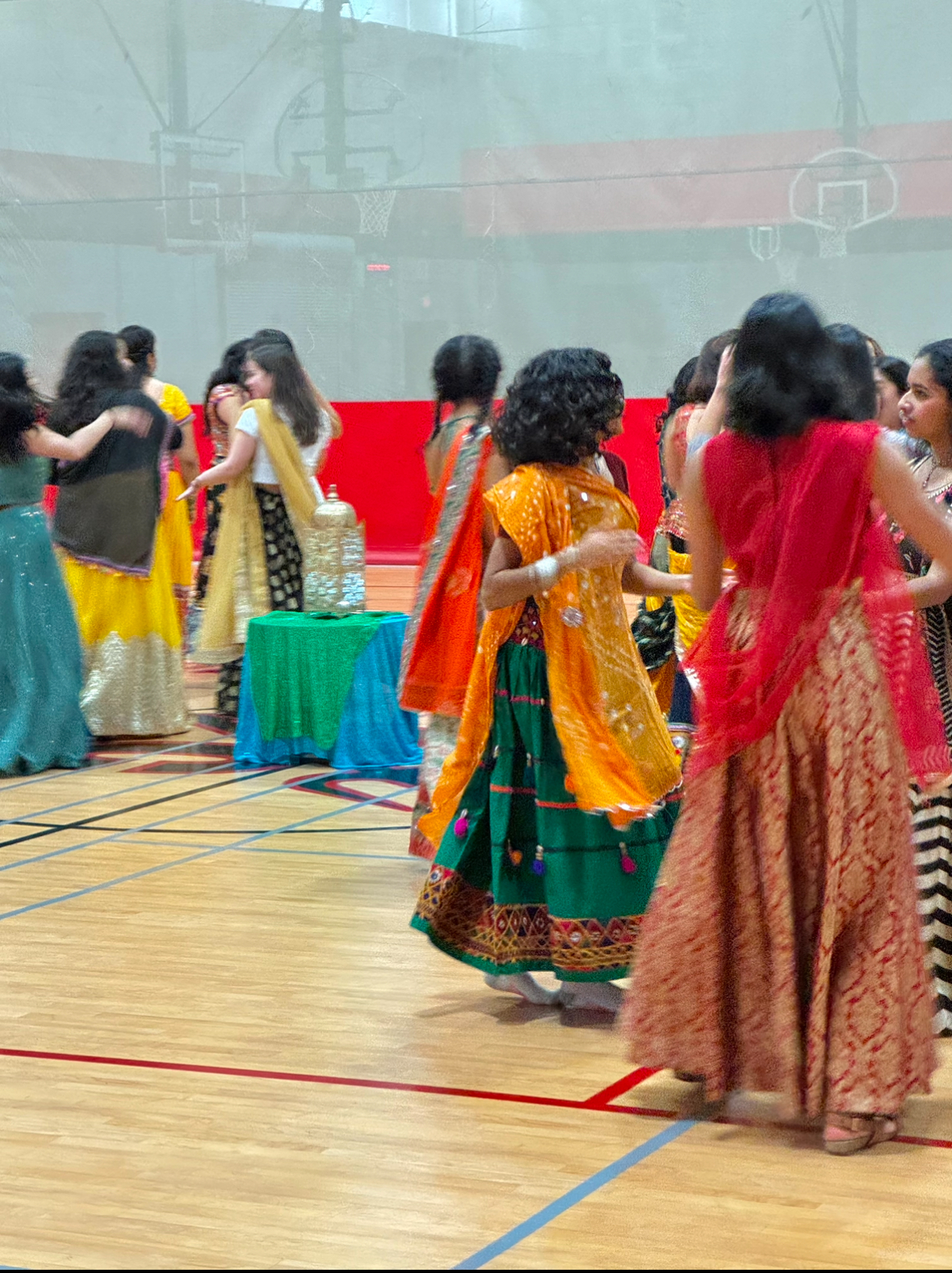 Students dance in the field house dressed in traditional South Asian clothing on Nov. 3 at Centrals first Garba night. 