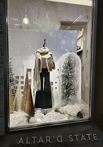 Window at Altard State in the Oakbrook Shopping Center displaying outfit for customers to buy during the cold season.
