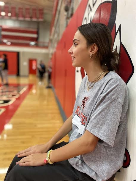 On Nov. 20, Junior Mia Batenic practices a wall sit during Group Exercise in the gymnasium before their day of toning.
