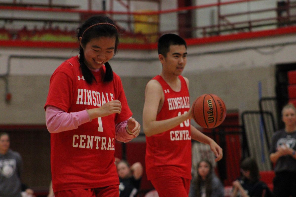 Kathy Zhang and Ricky Luo, seniors, share the court during the game.