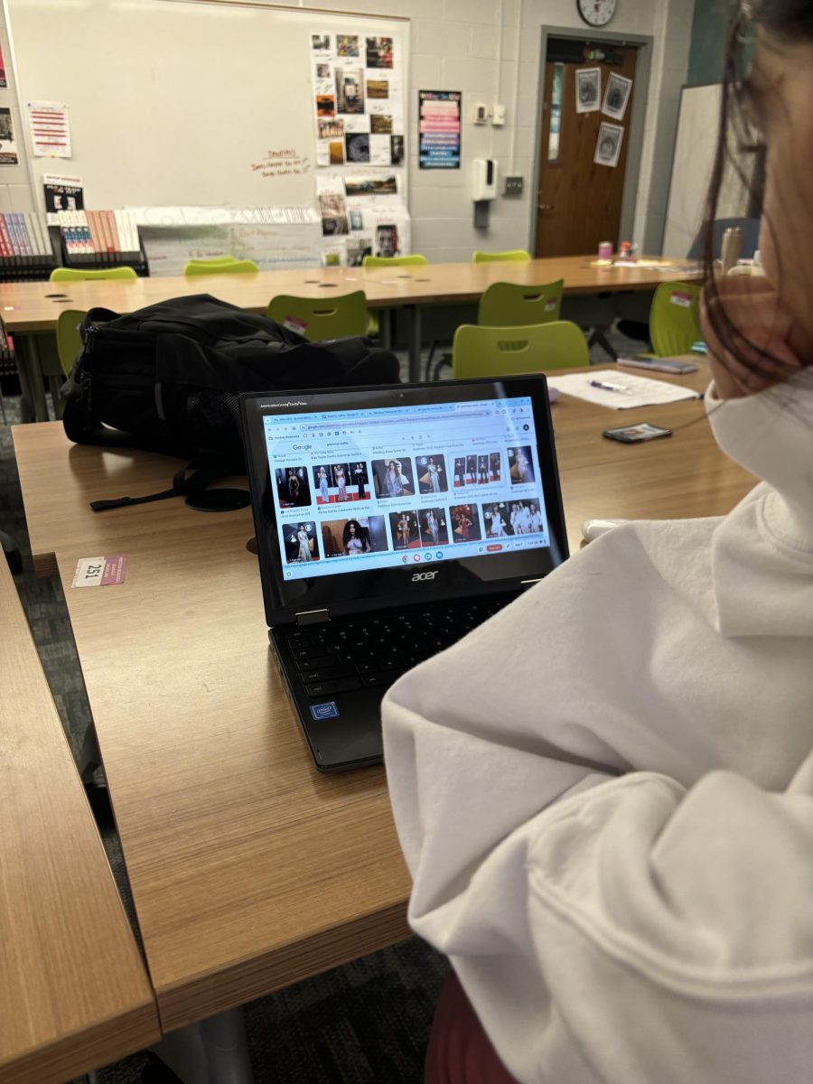 Student views Grammy outfits after the televised event aired on Saturday, Feb. 4.