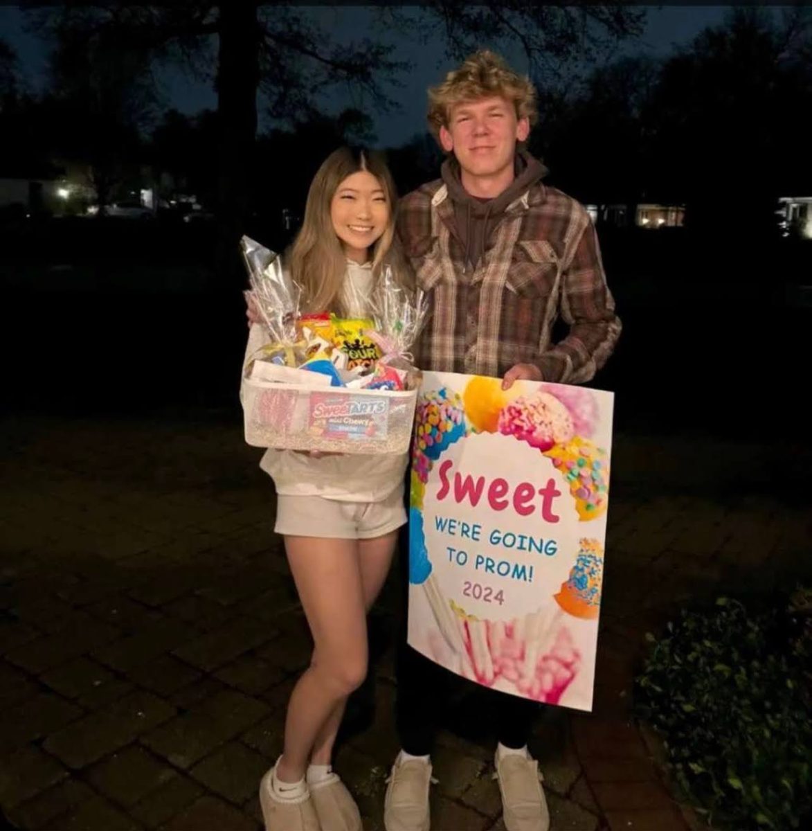 Sarah Cheung, senior, holding a gift basket given to her by Austin Marconi, senior, for his “promposal.”