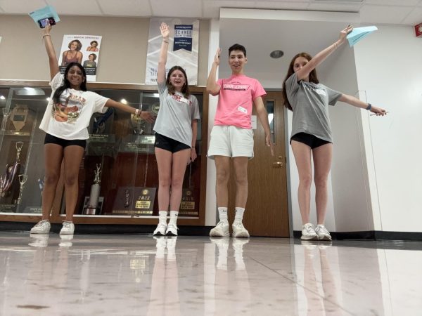 From left to right: Janu Suthan  (senior), Emma Murphy (senior), Kaan Turkyilmaz (senior), and Lily Hodneland (junior) attend Link Crew training prior to the first day of school.