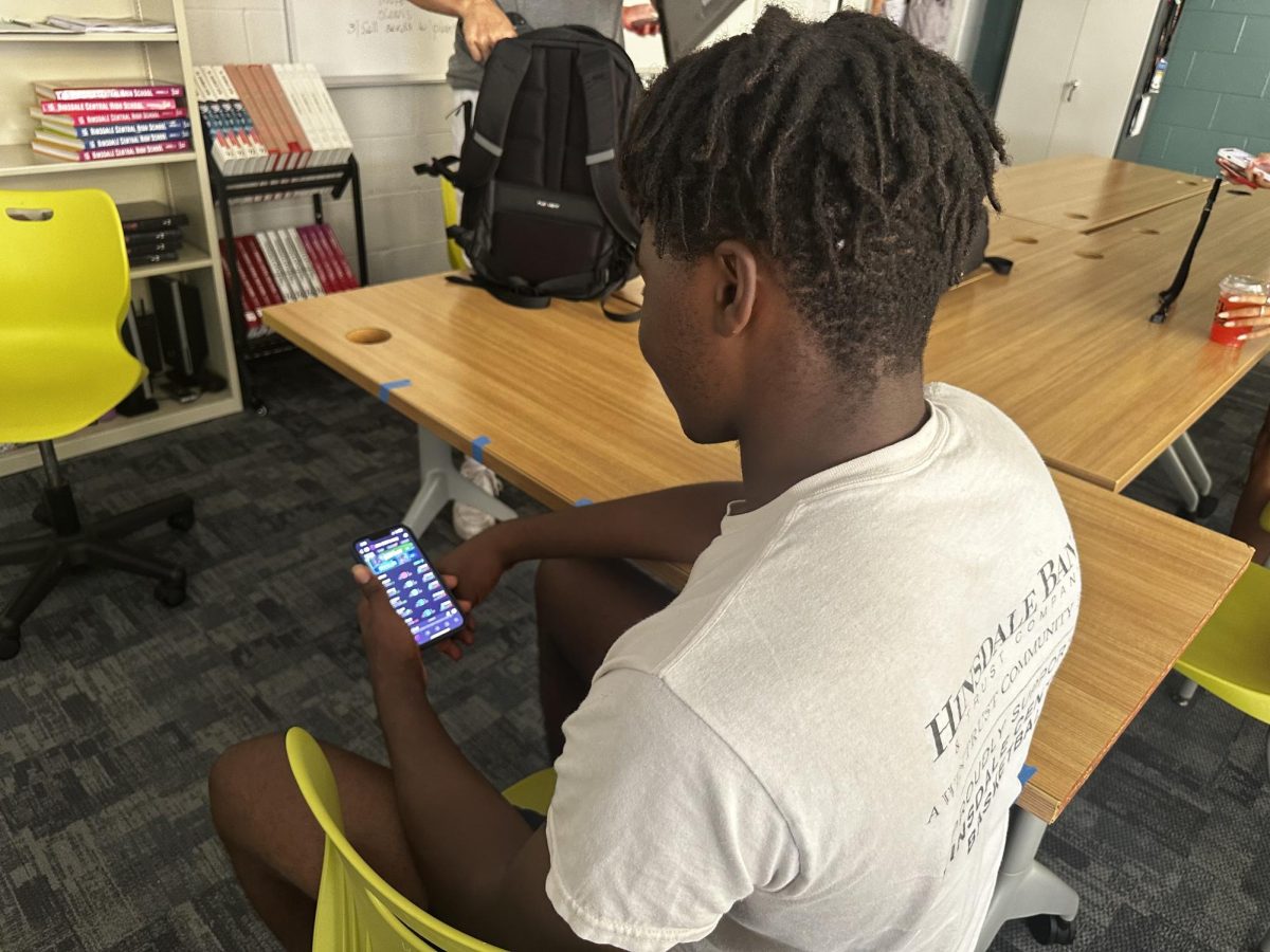 Senior Tobi Oranu looks at his fantasy football lineup during a break in his afternoon classes. 
