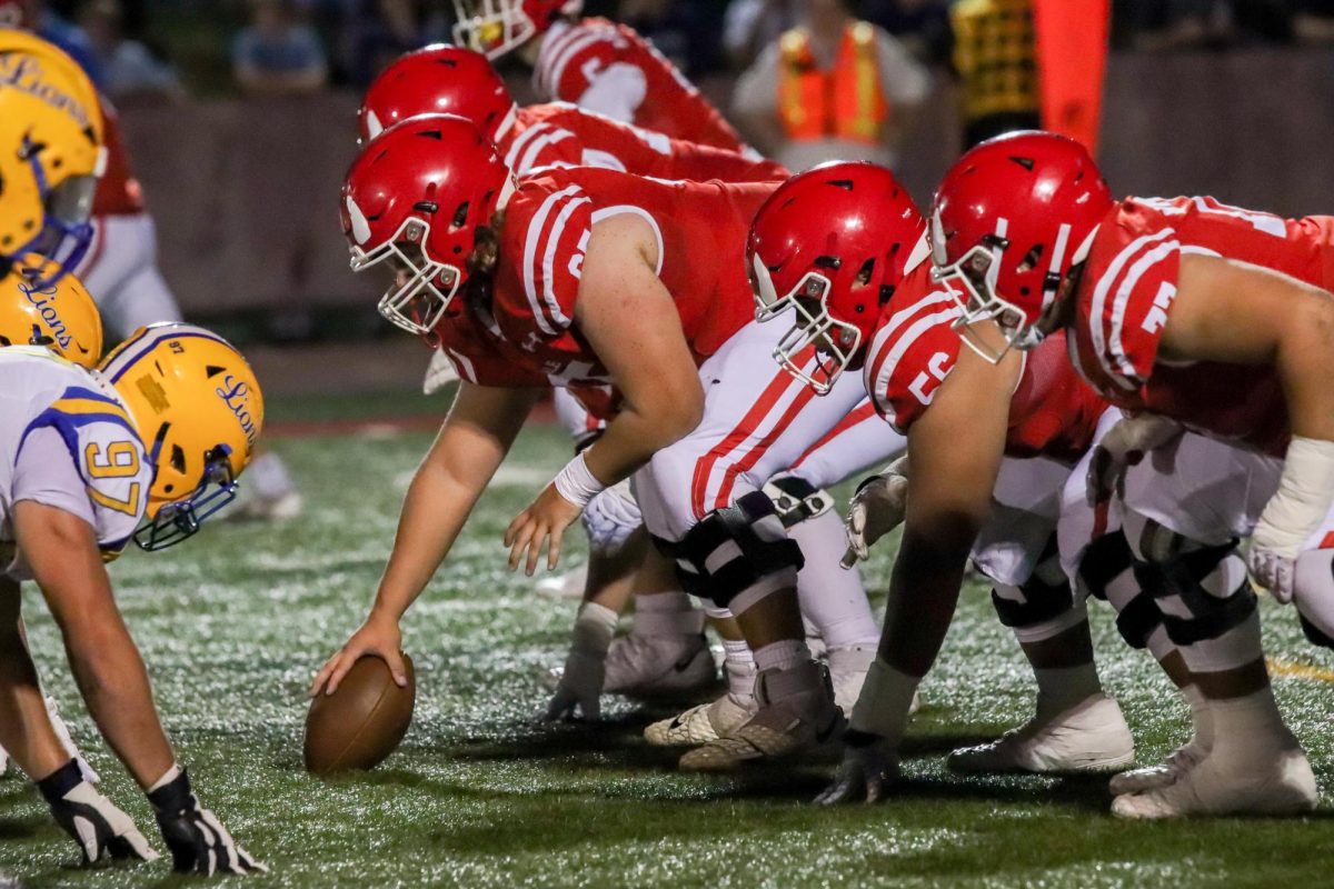 Players snap the ball to the quarterback. 