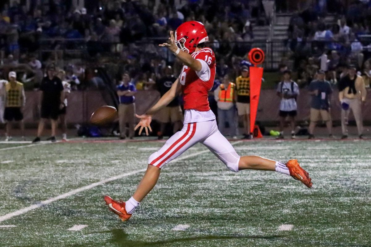 Micah Drescher, junior, goes for a field goal. 