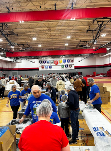 Students in the Red Devil Service Club, and other volunteers, supported the “Feed My Starving Children” organization by putting together meals for children in poverty around the world in the Hinsdale Central field house.
