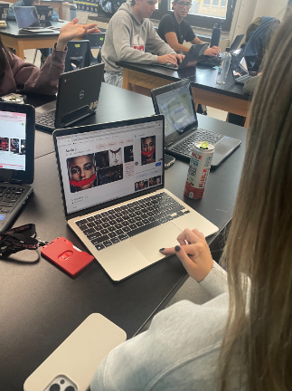 Addison Griebenow, senior, looking at the movie poster for “Smile 2.”
