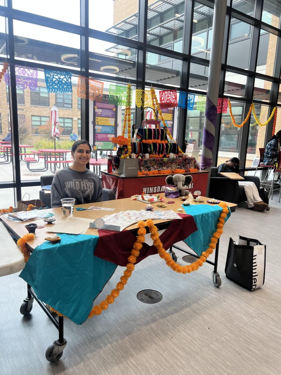 Myra Dhillon, sophomore, runs the Diwali table during fourth lunch. 