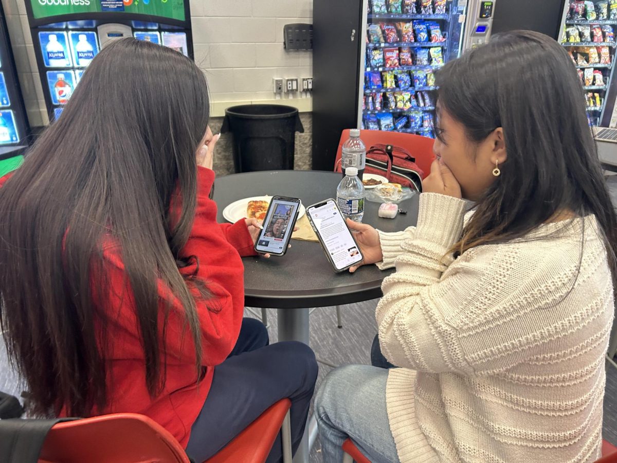 Sarah Delapeña (senior) and Alyssa Kendle (senior) learn about the Zach Bryan drama. 