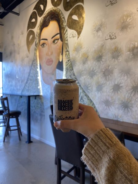 Zahra Haque, senior, poses with her brownie frappuccino.