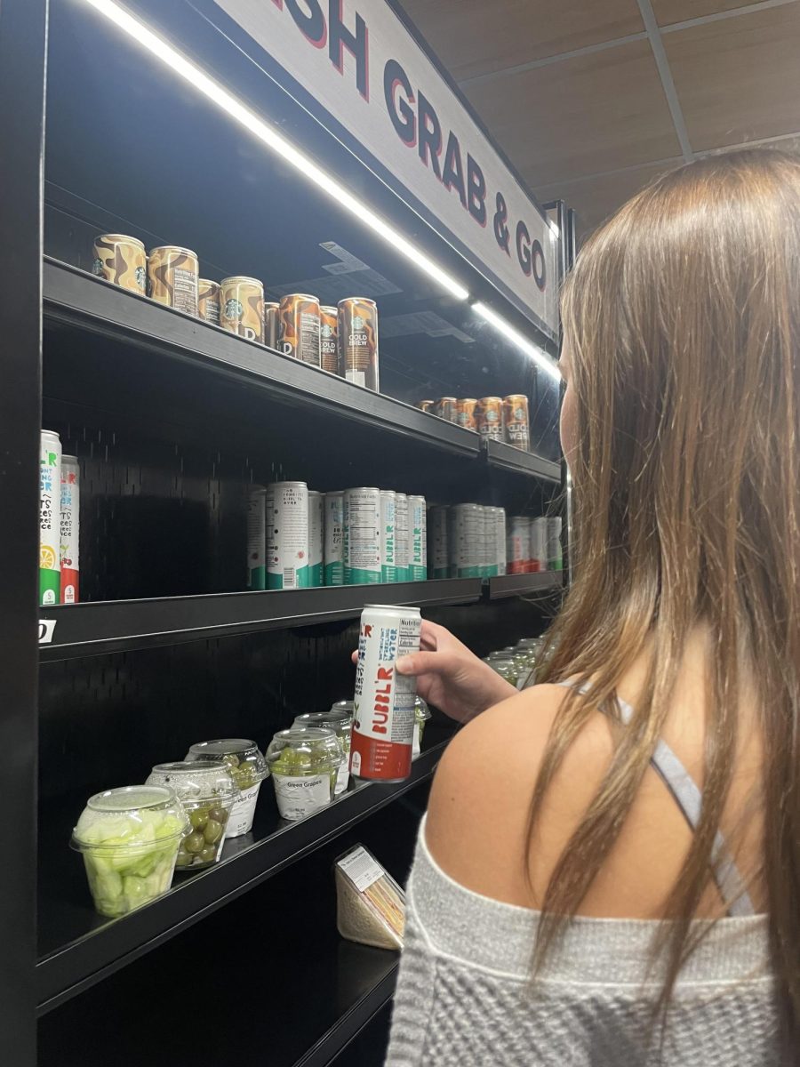 Junior Willa Braden purchases BUBBL'R from cafeteria.