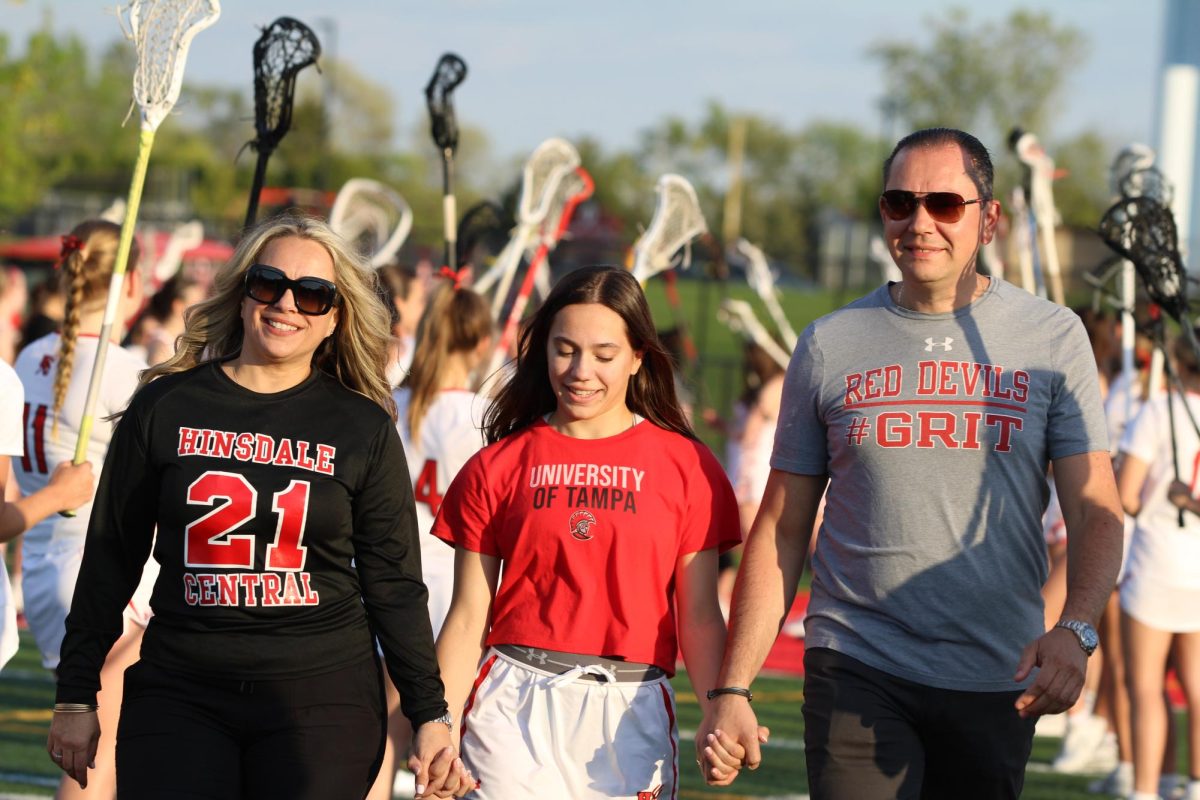Senior Stefani Andrews walks the field to celebrate senior night on May 6. 