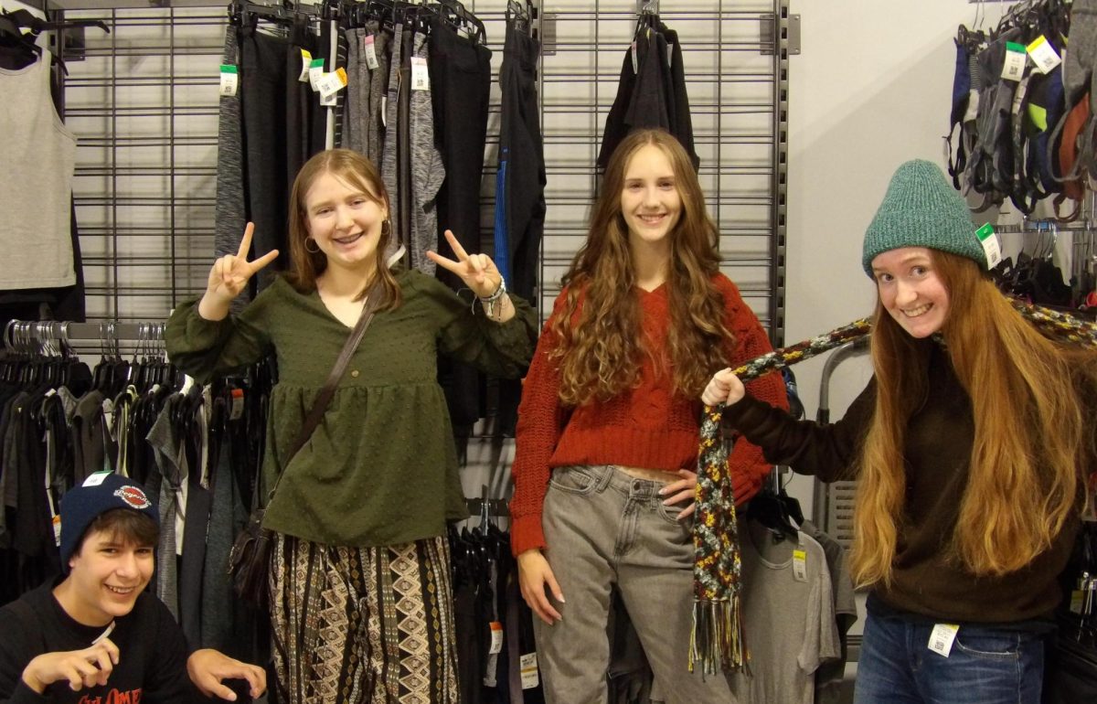 Sophomore Ashley Pionke, junior Damian Ferrer and freshman Alicia Terzinski enjoy shopping at Goodwill on Oct. 12. 