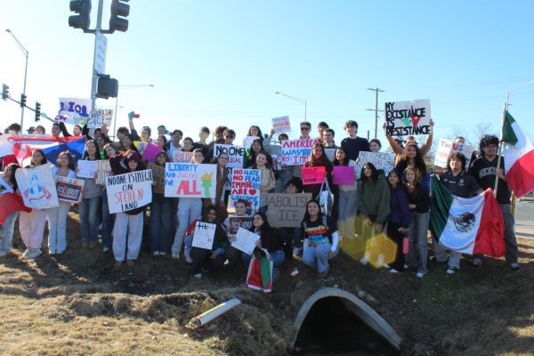 A crowd gathers for a picture after the protest on Wednesday, Feb. 18.