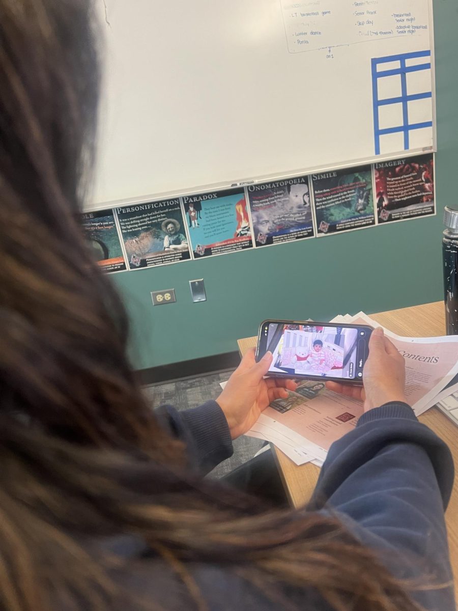 Jiya Joshi, senior, sharing her baby photos to her journalism class. 