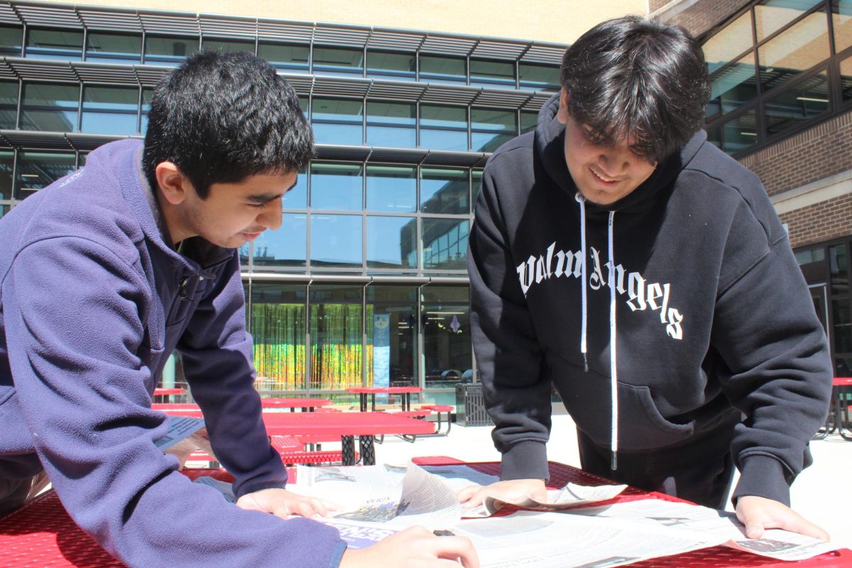 Senior Adam Izhar and junior Ayaan Baig voice their opinions on the news on March 12.