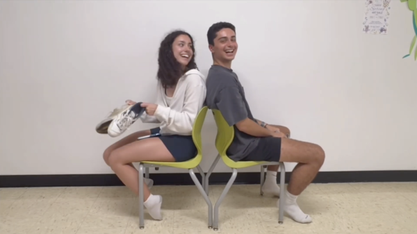 Seniors Isabella Chiaramonte and Niko Miceli answer questions for prom on April 17.