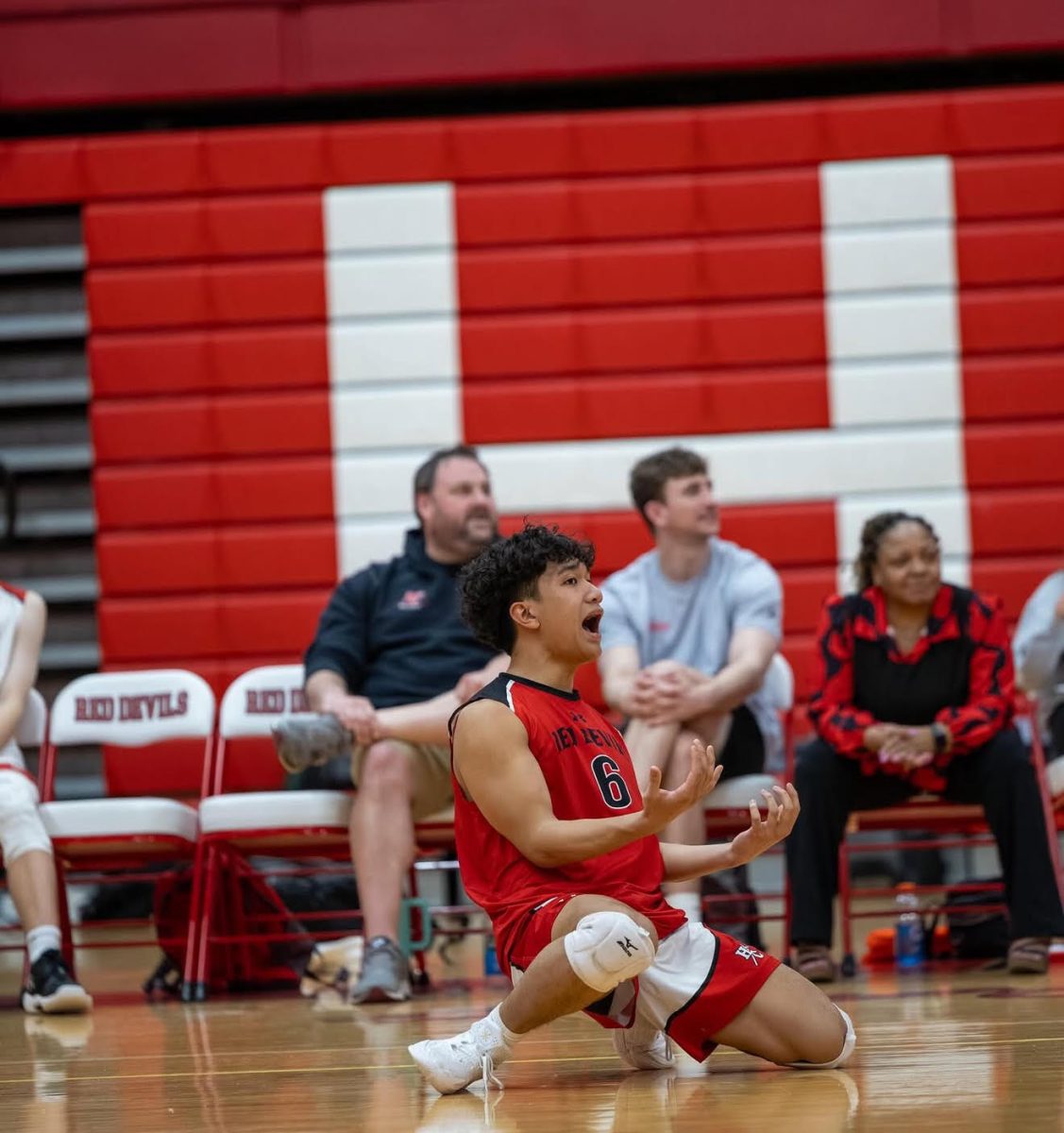 A photo of varsity player, Ken Reodica, mid play during his game against Lockport High School on March 25; the Devils lost the game.  